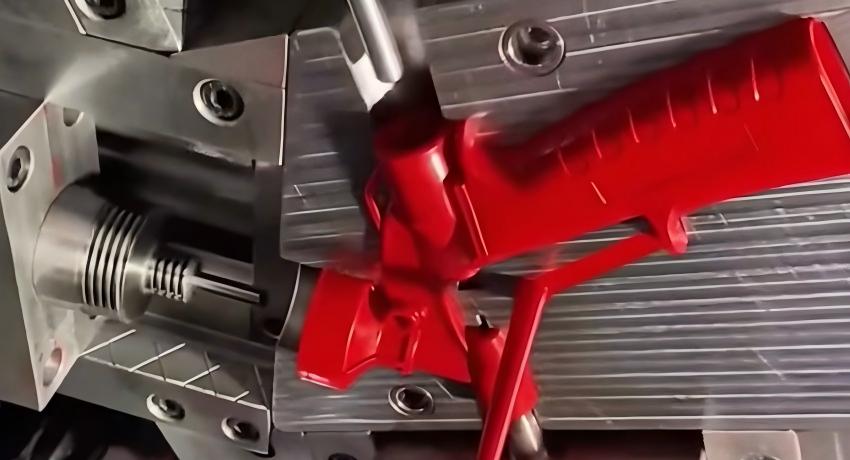 Red plastic handles produced through nylon injection moulding