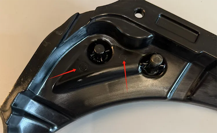 ejector-marks-on-injection-molded-parts Ejector marks on an injection molded plastic part surface showing circular indentation