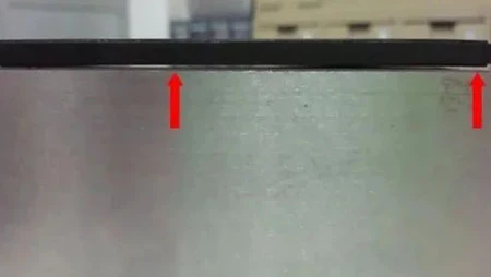 Injection moulding warpage defect on a plastic enclosure causing deformation and poor fit.