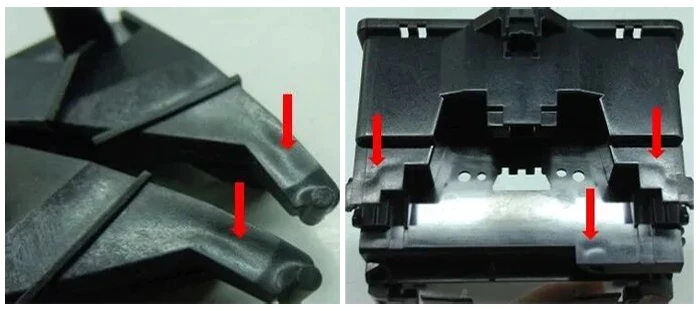 Sink mark defect on injection-moulded plastic part caused by uneven cooling and shrinkage.