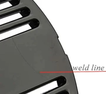 Close up of weld line defect on plastic housing surface